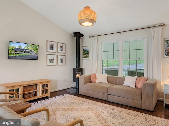 439 Windy Way, Front Royal, VA 22630 - living room featuring dark wood-style flooring, a wood stove, lofted ceiling, and baseboards