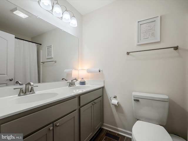 439 Windy Way, Front Royal, VA 22630 - full bathroom with toilet, wood finished floors, double vanity, and baseboards