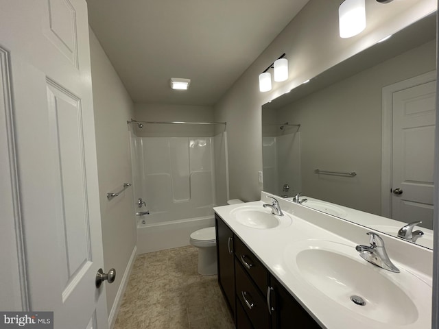 full bathroom with toilet, tub / shower combination, double vanity, and baseboards