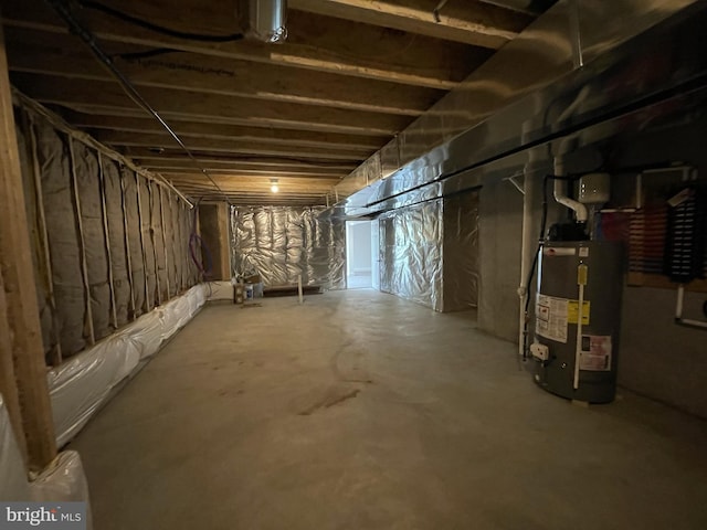 unfinished basement with gas water heater