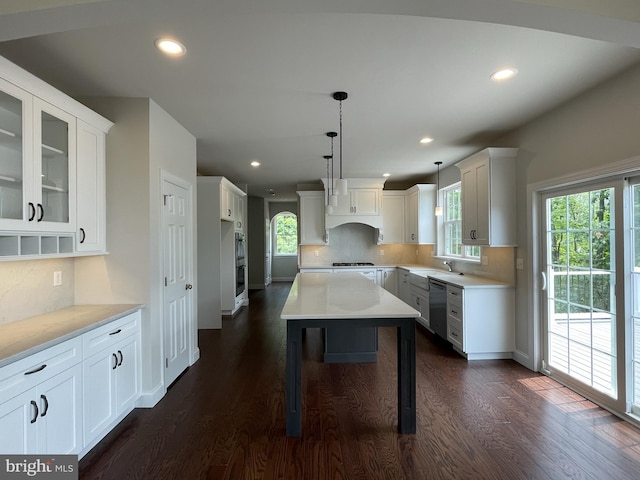 kitchen featuring tasteful backsplash, plenty of natural light, a center island, white cabinetry, and recessed lighting