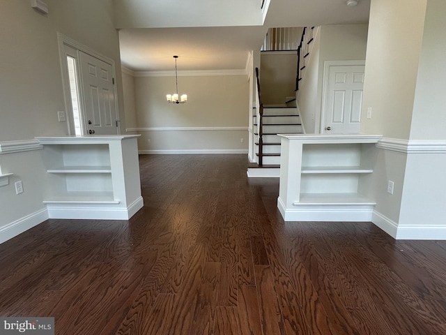 foyer entrance with dark wood-style flooring, stairway, a chandelier, and baseboards