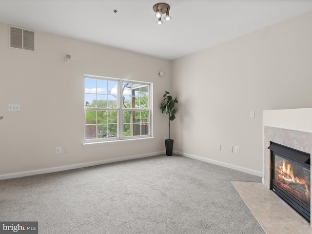 1604 Hunting Creek Dr Unit B, Alexandria, VA 22314 - unfurnished living room with carpet, a tiled fireplace, and baseboards