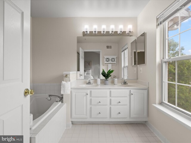 1604 Hunting Creek Dr Unit B, Alexandria, VA 22314 - full bath with double vanity, a bath, tile patterned floors, and healthy amount of natural light