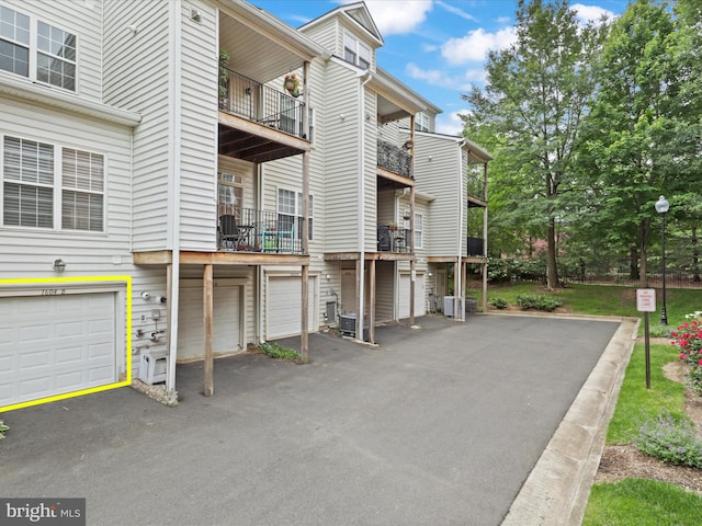 1604 Hunting Creek Dr Unit B, Alexandria, VA 22314 - view of side of property with an attached garage and a balcony