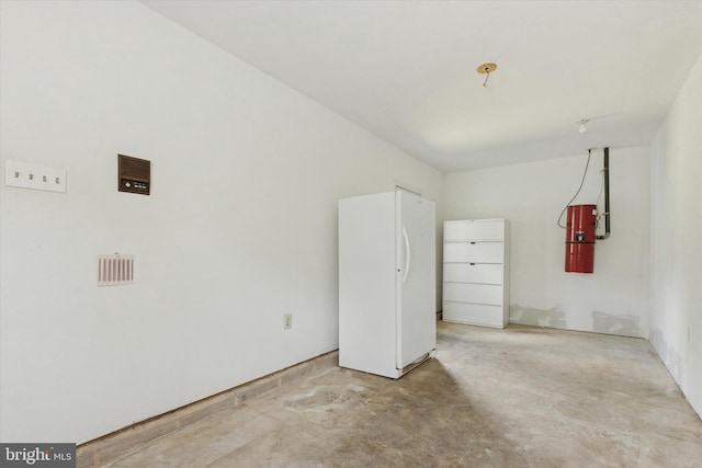 3789 Stump Rd, Doylestown, PA 18902 - garage with a central vacuum unit and freestanding refrigerator
