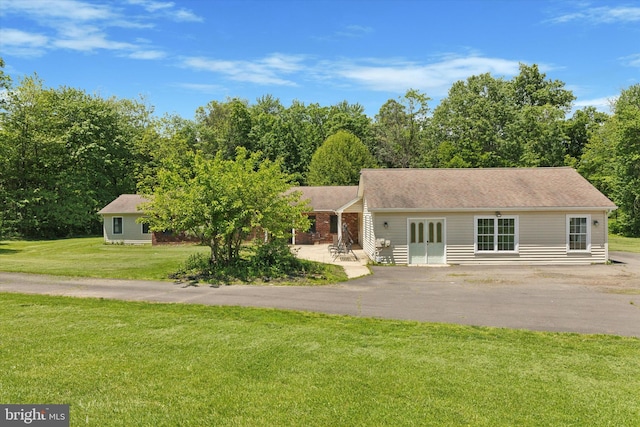 3789 Stump Rd, Doylestown, PA 18902 - view of front of house with a front lawn, asphalt driveway, and french doors