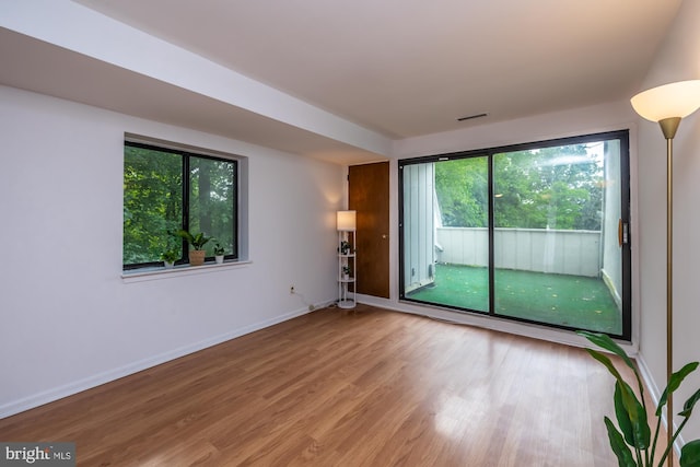 264 Summit House Unit 264, West Chester, PA 19382 - unfurnished room with wood finished floors and baseboards