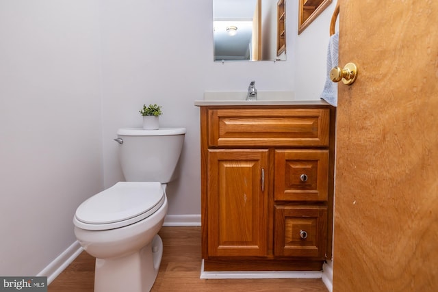 264 Summit House Unit 264, West Chester, PA 19382 - half bath with toilet, baseboards, vanity, and wood finished floors