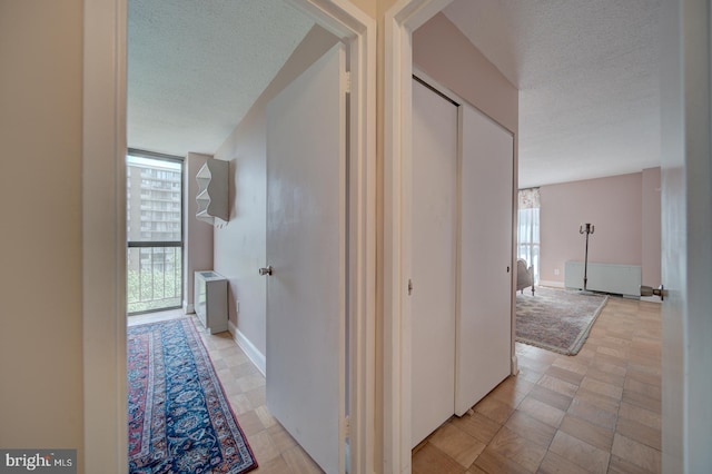 6100 Westchester Park Dr Unit 804, College Park, MD 20740 - hallway with a textured ceiling