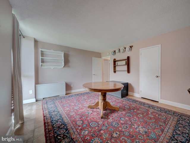 6100 Westchester Park Dr Unit 804, College Park, MD 20740 - hall with radiator, baseboards, and a textured ceiling