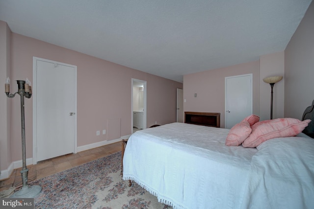 6100 Westchester Park Dr Unit 804, College Park, MD 20740 - bedroom with baseboards and ensuite bathroom