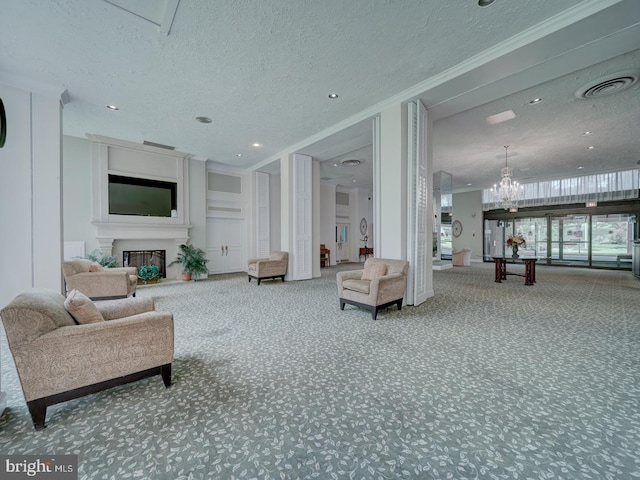 6100 Westchester Park Dr Unit 804, College Park, MD 20740 - living room with a textured ceiling, carpet, a fireplace, ornamental molding, and a chandelier