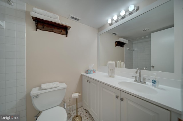 6100 Westchester Park Dr Unit 804, College Park, MD 20740 - full bathroom with a tile shower, toilet, and vanity