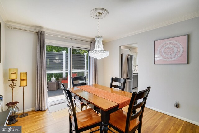 5101 Ampthill Dr, Alexandria, VA 22312 - dining space featuring a chandelier, light wood-style flooring, baseboards, and crown molding