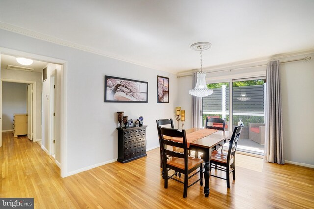 5101 Ampthill Dr, Alexandria, VA 22312 - dining room featuring light wood-style floors, baseboards, ornamental molding, and a chandelier