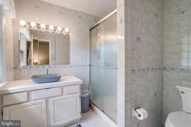 5101 Ampthill Dr, Alexandria, VA 22312 - full bath featuring tile walls, toilet, a stall shower, tile patterned flooring, and vanity