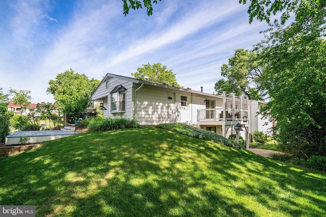 5101 Ampthill Dr, Alexandria, VA 22312 - rear view of house featuring a yard and a wooden deck