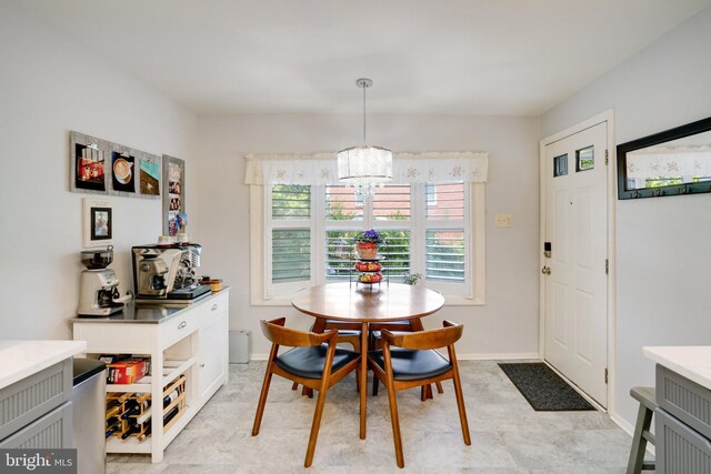 5101 Ampthill Dr, Alexandria, VA 22312 - dining space featuring a chandelier and baseboards