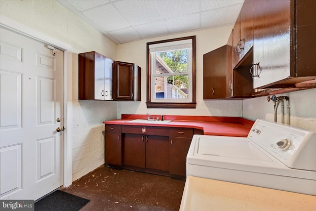 washroom featuring cabinet space and washer / dryer
