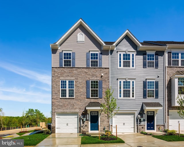 14 Chesapeake Ln Unit C, La Plata, MD 20646 - view of property with stone siding, driveway, and a garage