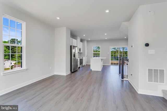 14 Chesapeake Ln Unit C, La Plata, MD 20646 - unfurnished living room with recessed lighting, wood finished floors, and baseboards