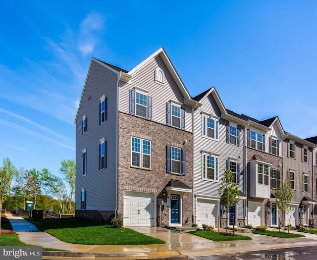 14 Chesapeake Ln Unit C, La Plata, MD 20646 - townhome / multi-family property with stone siding, a garage, concrete driveway, and a residential view