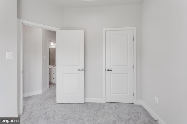 14 Chesapeake Ln Unit C, La Plata, MD 20646 - unfurnished bedroom featuring carpet floors and baseboards
