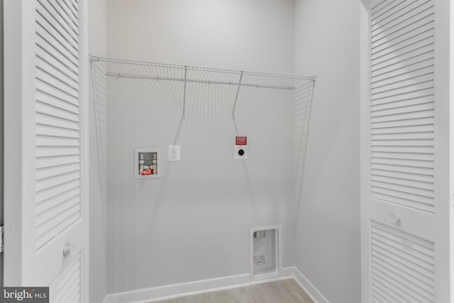 14 Chesapeake Ln Unit C, La Plata, MD 20646 - laundry area featuring washer hookup, hookup for an electric dryer, baseboards, and light wood-style floors