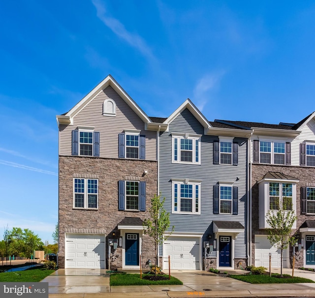 14 Chesapeake Ln Unit C, La Plata, MD 20646 - view of property with stone siding, driveway, and a garage