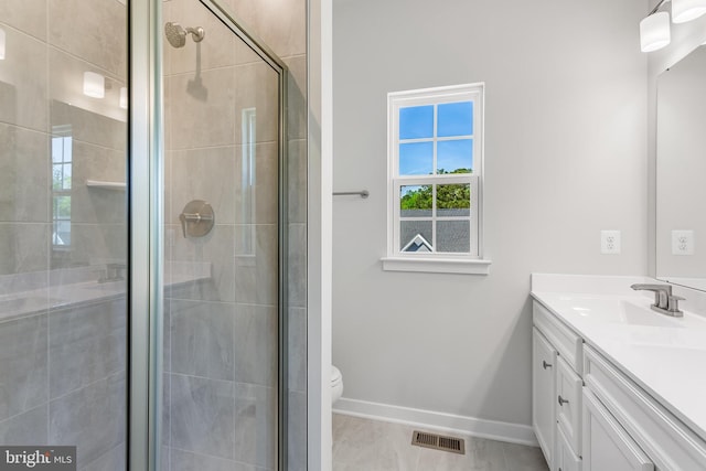 14 Chesapeake Ln Unit C, La Plata, MD 20646 - bathroom featuring vanity, toilet, a shower stall, and baseboards
