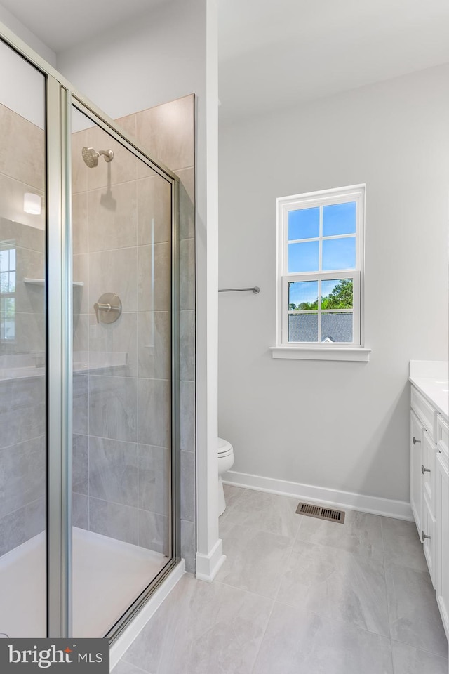 14 Chesapeake Ln Unit C, La Plata, MD 20646 - bathroom with vanity, baseboards, toilet, and a stall shower