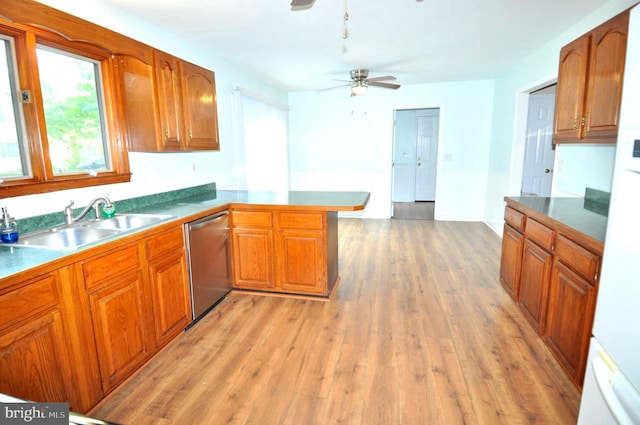 kitchen featuring stainless steel dishwasher, a sink, brown cabinetry, light wood finished floors, and a ceiling fan