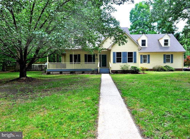 view of front facade featuring a porch, a front yard, and crawl space