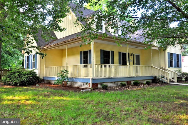 view of front facade with covered porch and a front yard