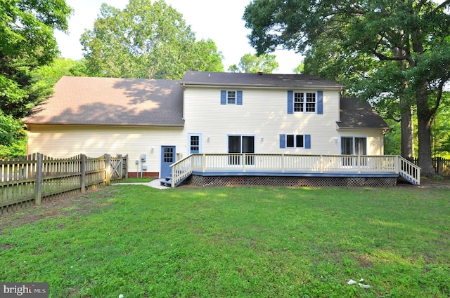 rear view of property with a wooden deck