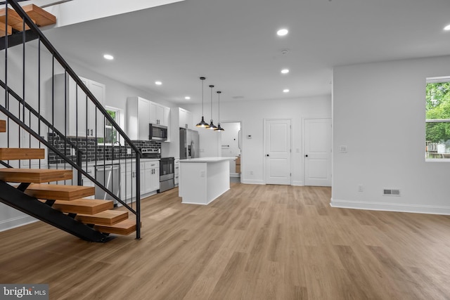 2564 Forrest Ave, Bensalem, PA 19020 - kitchen featuring stainless steel appliances, light wood-style flooring, baseboards, white cabinetry, and recessed lighting