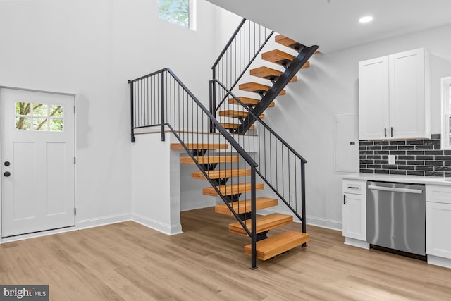 2564 Forrest Ave, Bensalem, PA 19020 - entrance foyer with light wood-style floors, baseboards, stairway, recessed lighting, and a towering ceiling