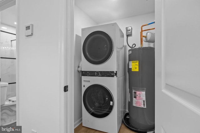 2564 Forrest Ave, Bensalem, PA 19020 - laundry area featuring stacked washing machine and dryer and water heater