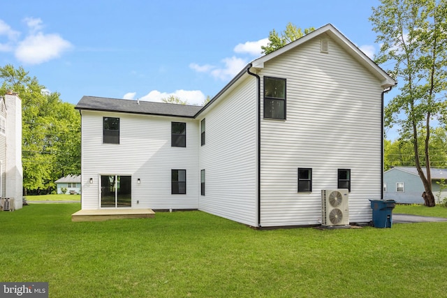 2564 Forrest Ave, Bensalem, PA 19020 - rear view of house featuring a lawn and a cooling unit