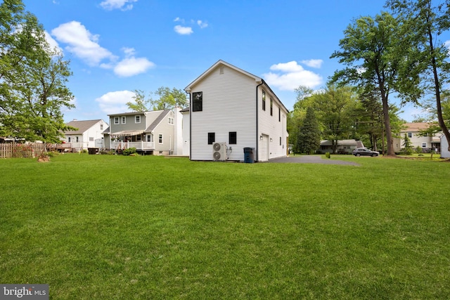 2564 Forrest Ave, Bensalem, PA 19020 - back of property featuring a garage, a yard, and driveway