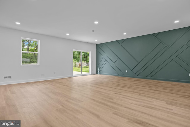 2564 Forrest Ave, Bensalem, PA 19020 - empty room with light wood finished floors, recessed lighting, a decorative wall, and baseboards