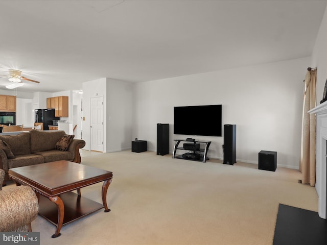 5204 Spanish Dollar Ct, Woodbridge, VA 22193 - living room featuring ceiling fan, light carpet, baseboards, and a fireplace