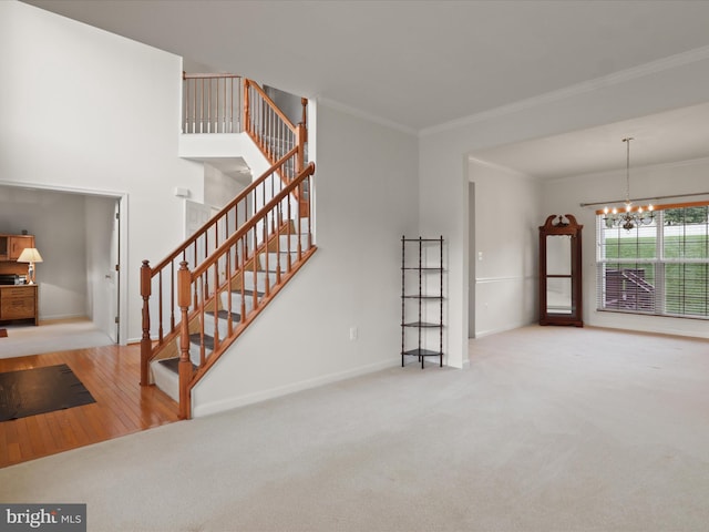 5204 Spanish Dollar Ct, Woodbridge, VA 22193 - unfurnished living room with a chandelier, crown molding, stairs, carpet flooring, and baseboards