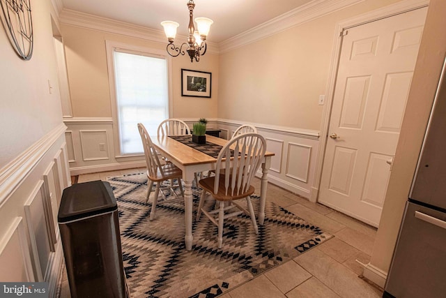 14365 Salsbury Ct, Woodbridge, VA 22193 - dining area with ornamental molding, a chandelier, light tile patterned flooring, a decorative wall, and wainscoting