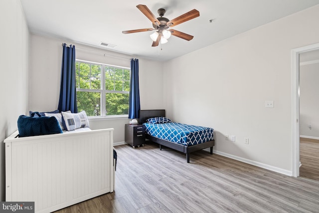 12958 Centre Park Cir Unit 219, Herndon, VA 20171 - bedroom with wood finished floors and ceiling fan