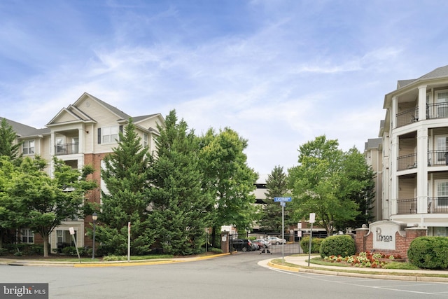 12958 Centre Park Cir Unit 219, Herndon, VA 20171 - view of asphalt road with curbs and a gated entry