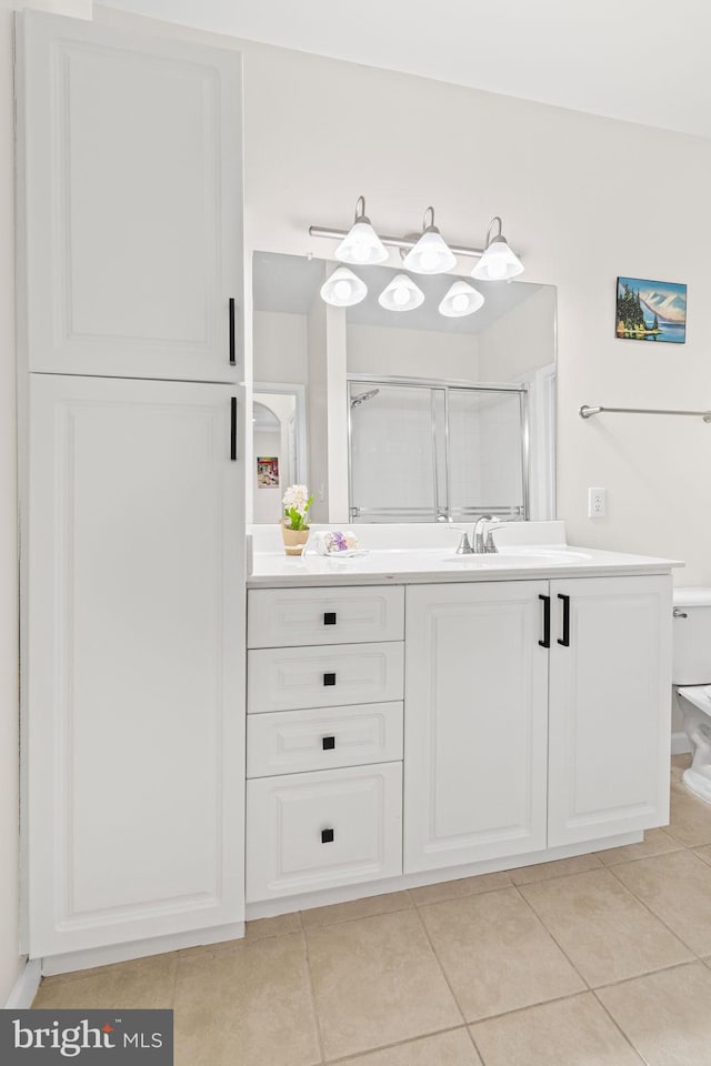 12958 Centre Park Cir Unit 219, Herndon, VA 20171 - bathroom with tile patterned floors, vanity, and a shower with shower door
