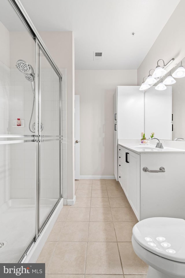 12958 Centre Park Cir Unit 219, Herndon, VA 20171 - bathroom featuring a stall shower, vanity, and tile patterned floors