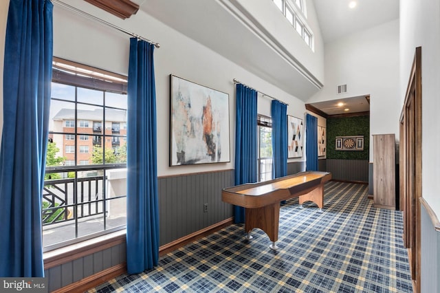 12958 Centre Park Cir Unit 219, Herndon, VA 20171 - home office featuring a wainscoted wall, healthy amount of natural light, wooden walls, and a high ceiling